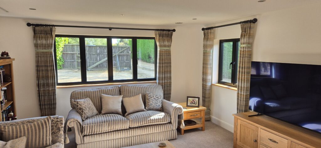 Made-to-measure curtains installed in a Cambridge home, enhancing warmth, privacy and interior style.